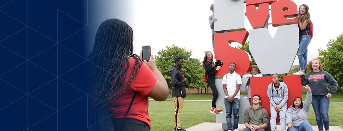 Students at the I love SVSU sign
