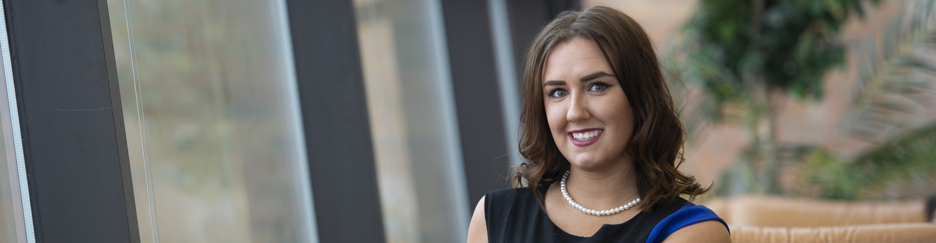 A former SVSU student poses for a picture her graduating year