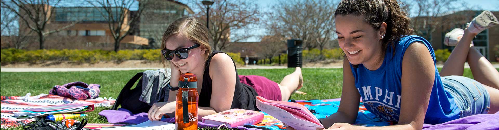 Students working on homework in the courtyard