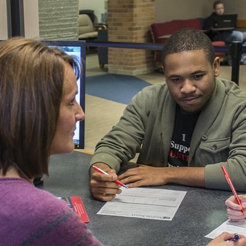 Students getting assistance with financial aid
