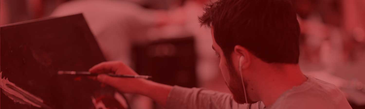 Student painting in class