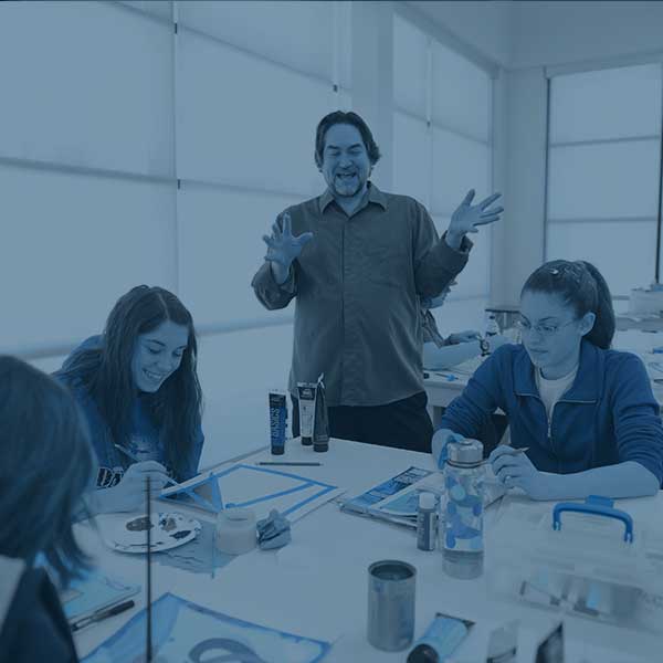 Professor helping students in class