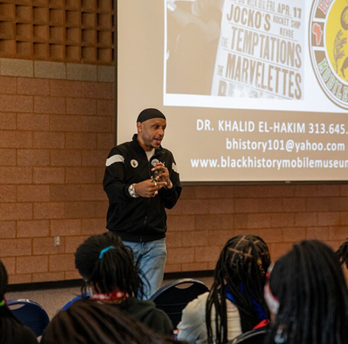 Speaker talking to group of students