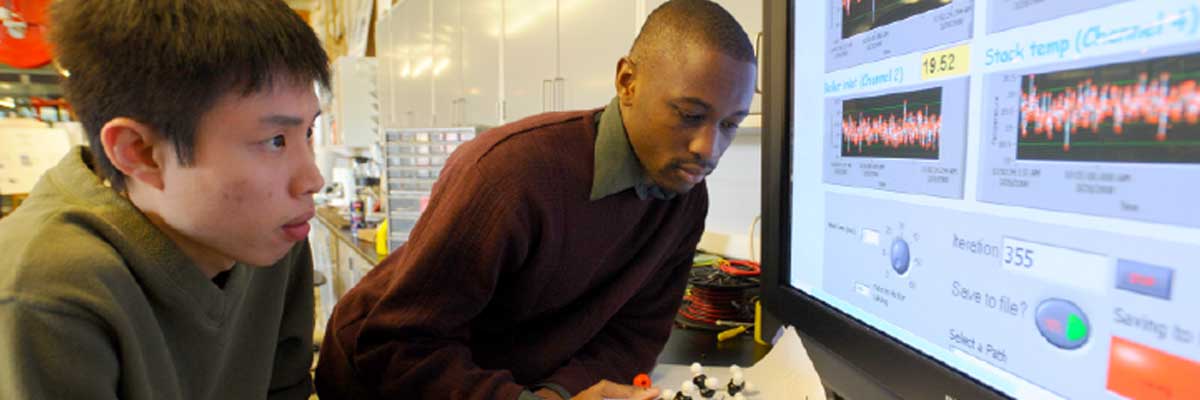 Students analyzing data at a computer