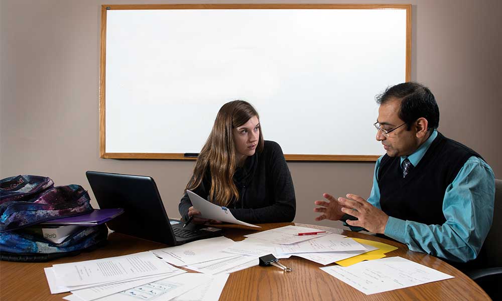 student getting advice and help with work