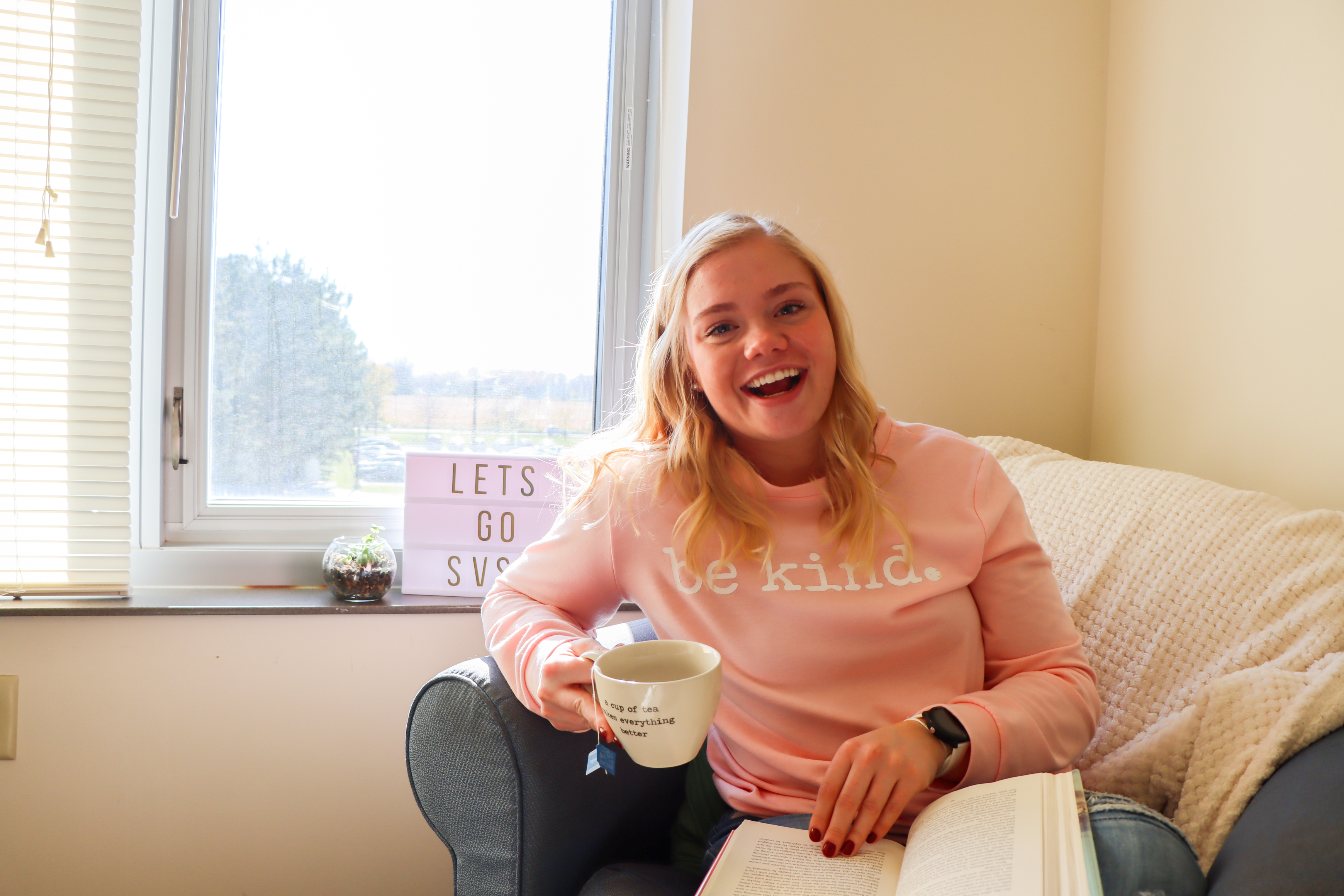 student is room sitting on chair