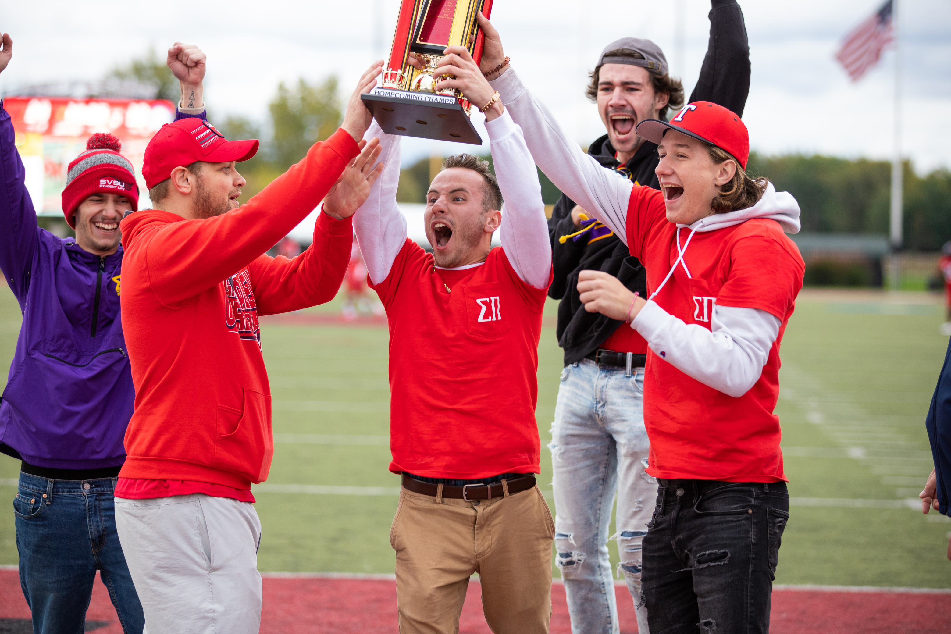 Student club holding trophy