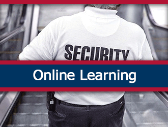 A security guard descends a staircase. A ribbon that says 