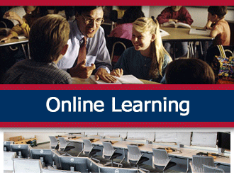 A teacher gives a group of students instructions at a table. A ribbon that says 