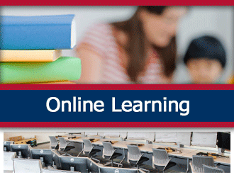 A teacher sits and helps a student. A ribbon that says 