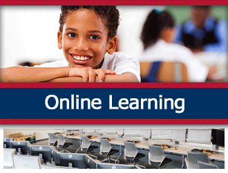 A student smiles while she works in a classroom. A ribbon that says 