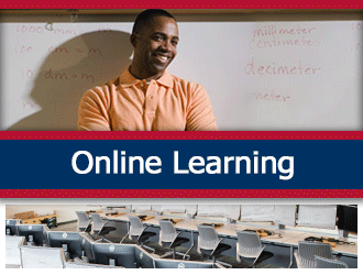 A teacher smiles in front of a white board. A ribbon that says 