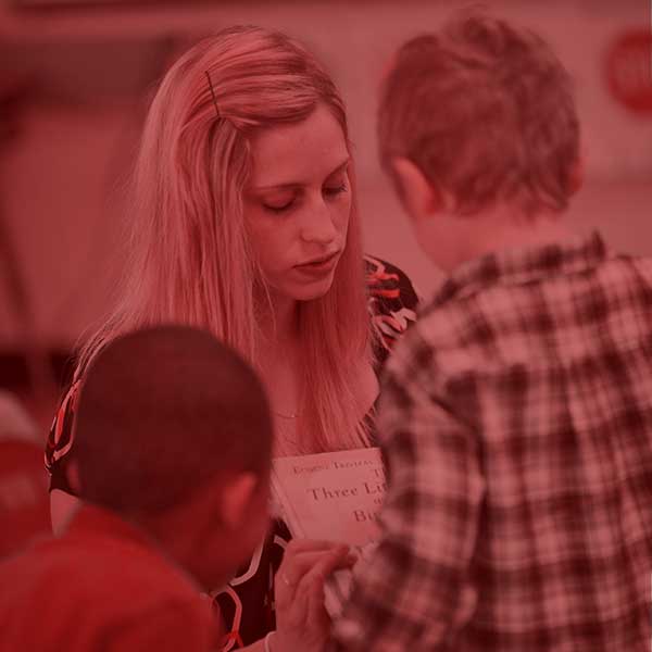 Student teacher helping students in the classroom