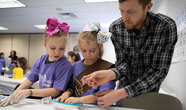 Teacher with two students at table