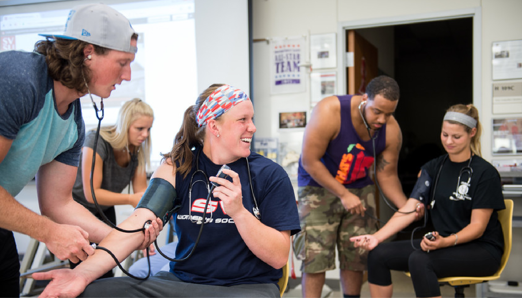 A lot of students working talking in a group