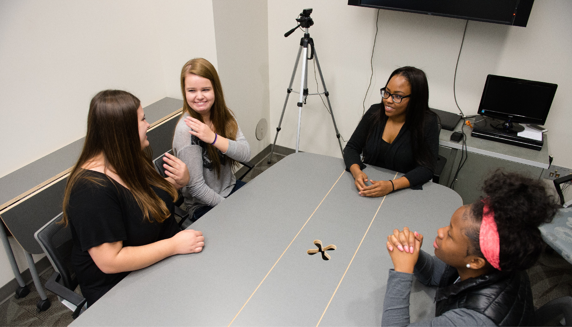 4 Students talking in a group