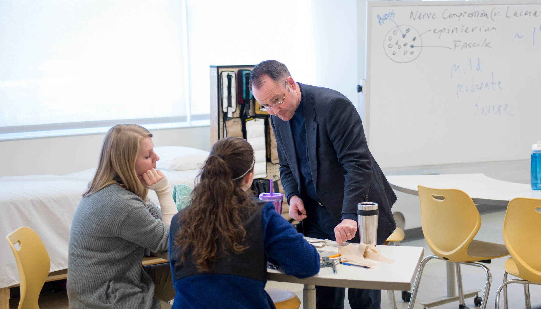 Two adults talking to someone important