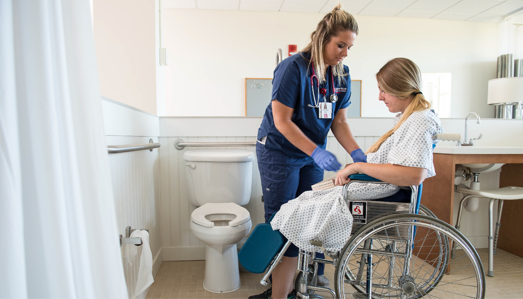 A nursing student taking care of a patient