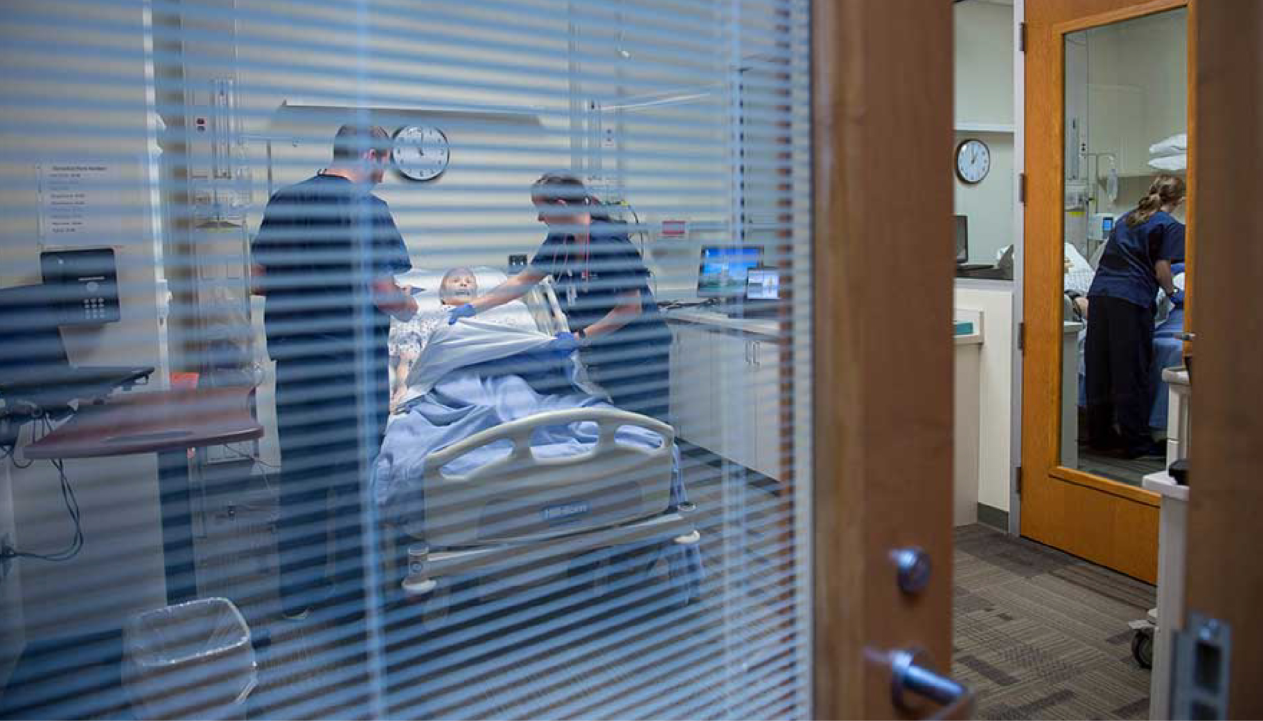Nursing students practicing care on a test patient