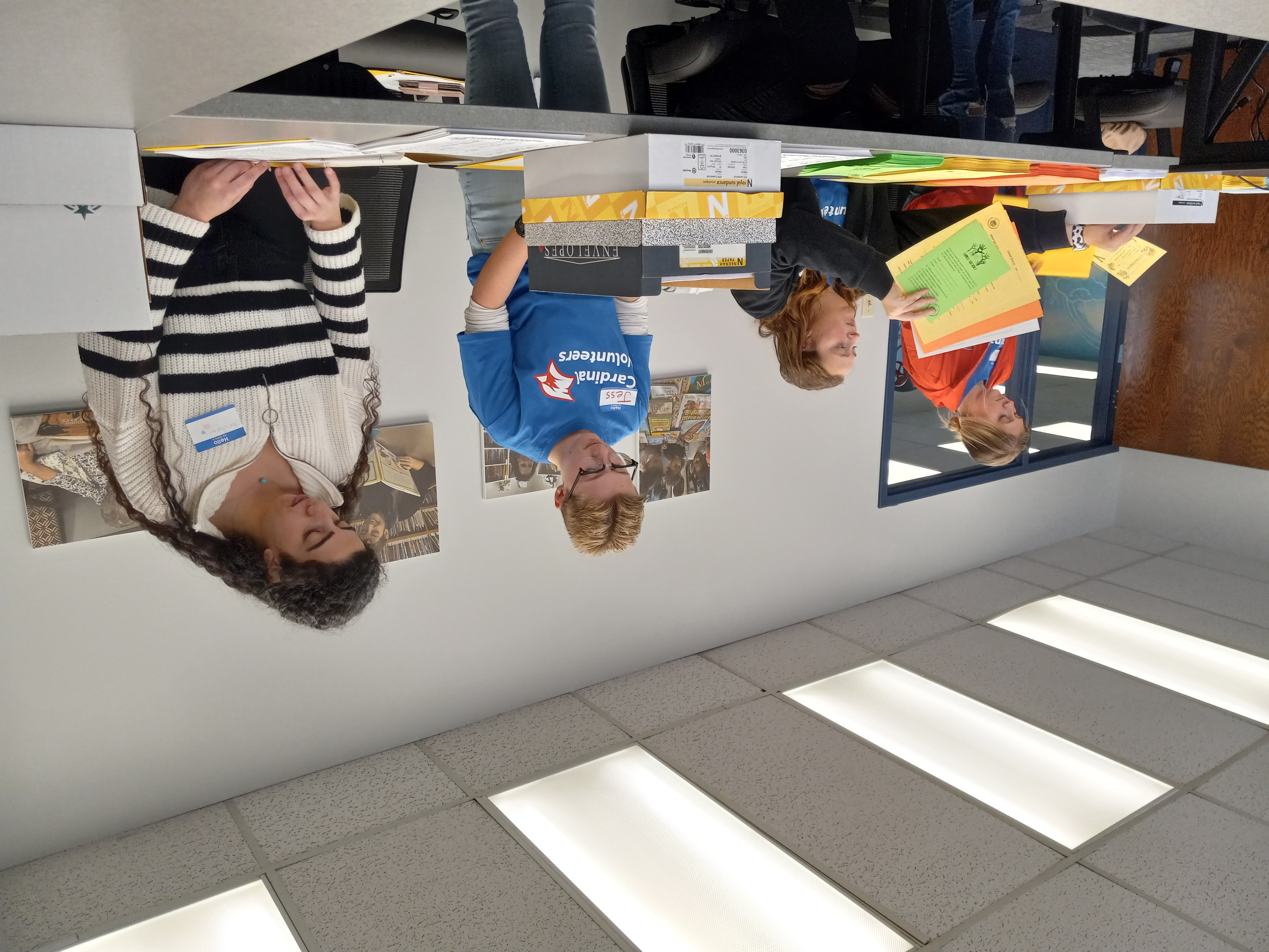 Cardinal Volunteers at READ Association, partial group, working