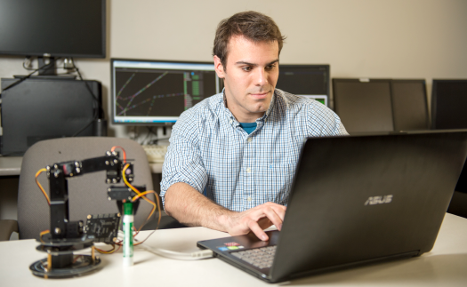 Student working on a laptop.