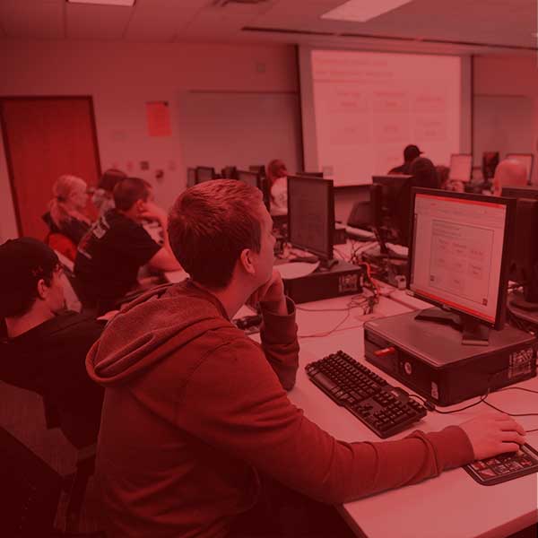 Students working at computers in class