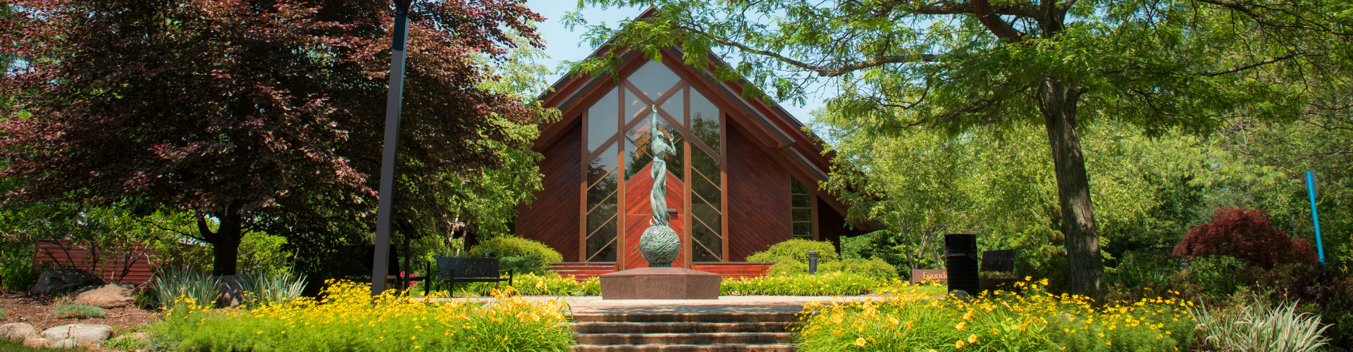Founders hall surrounded by foliage