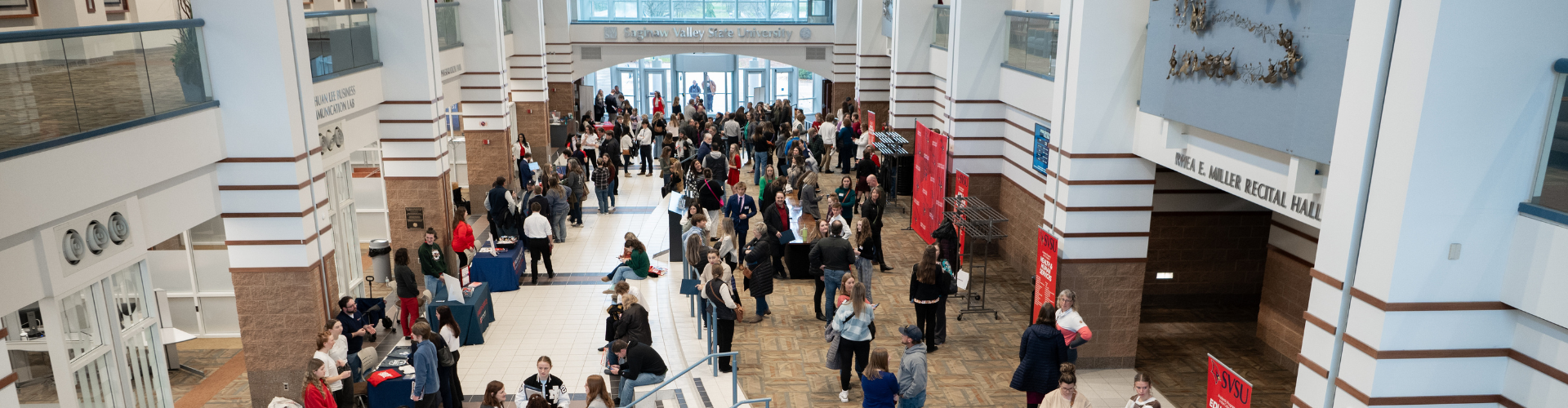 crowd gathered in large lobby area