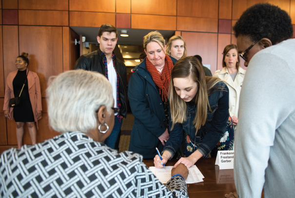 signing at leadership banquet