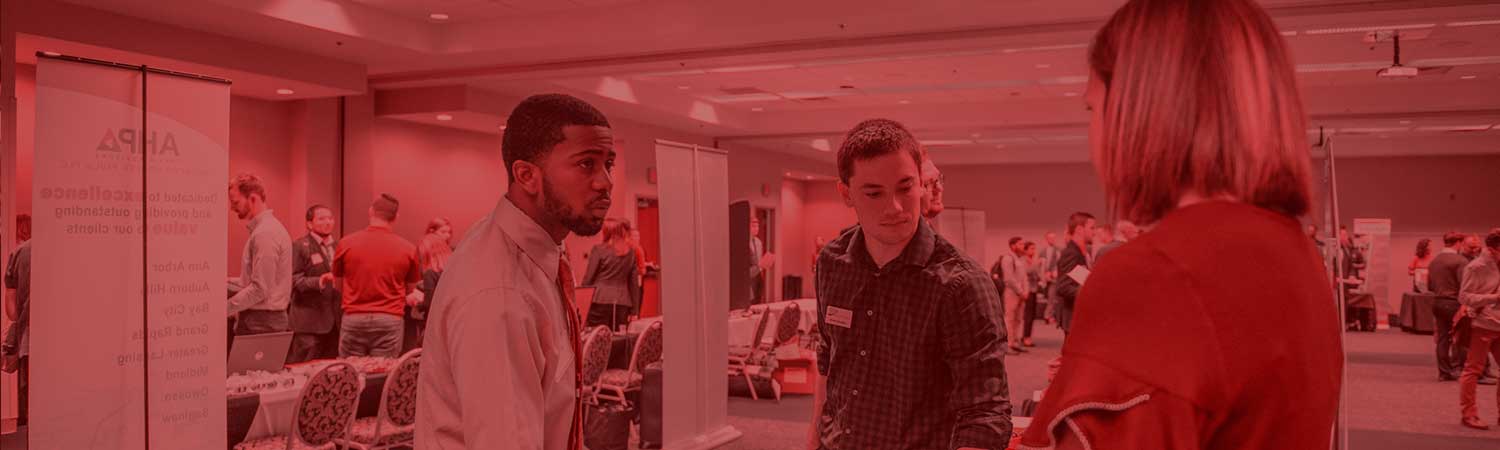 Students talking to an employer