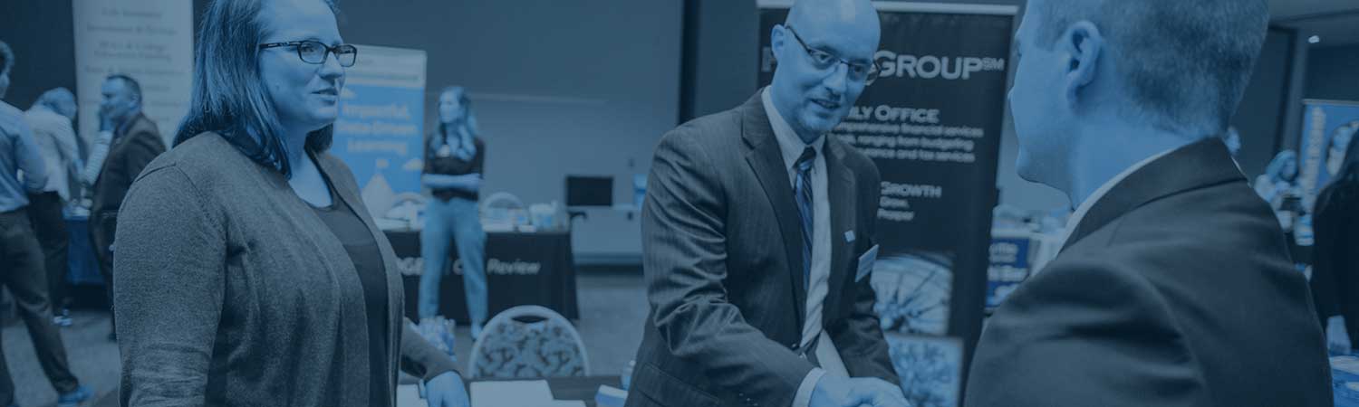 Student shaking hands with an employer