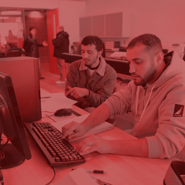 Electrical Engineering students working at a computer