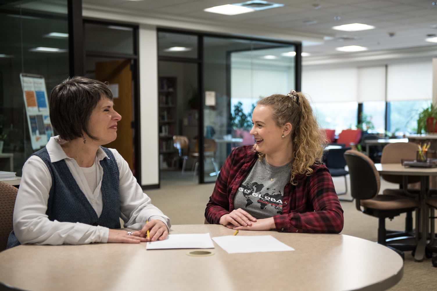 Writing Center helping student