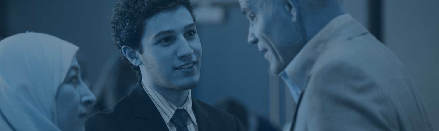 SVSU alumni interacting at an alumni banquet