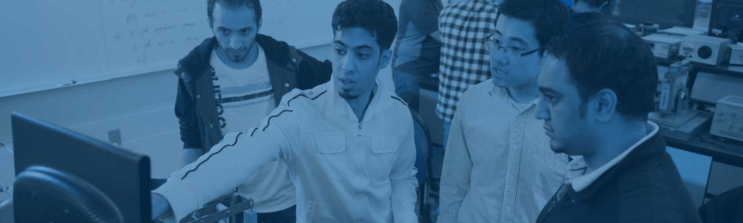 Students analyzing data on a computer