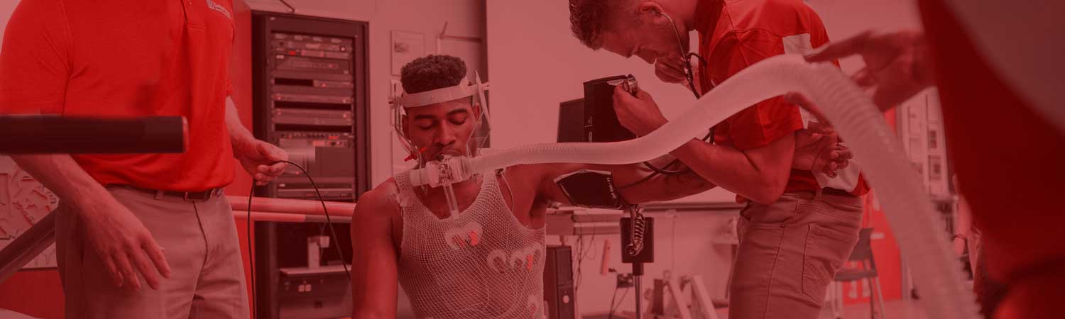 Kinesiology students performing assessments on a basketball student