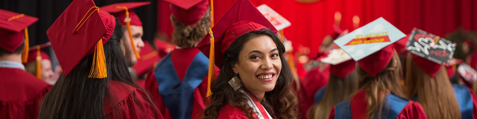 Graduate looking at camera
