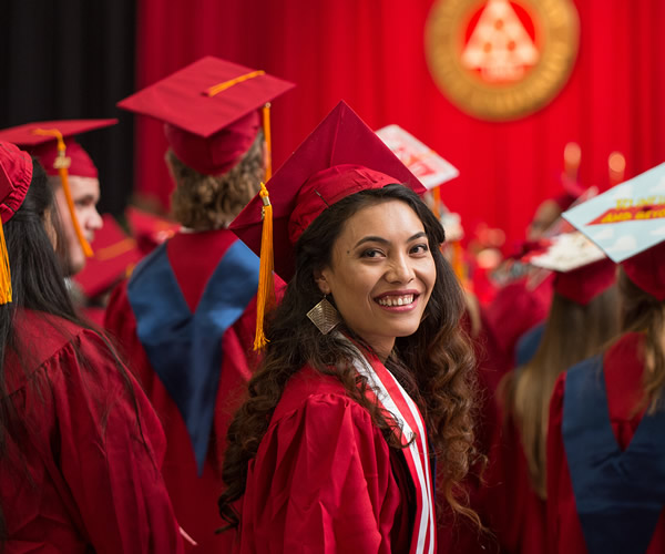 Graduate looking at camera