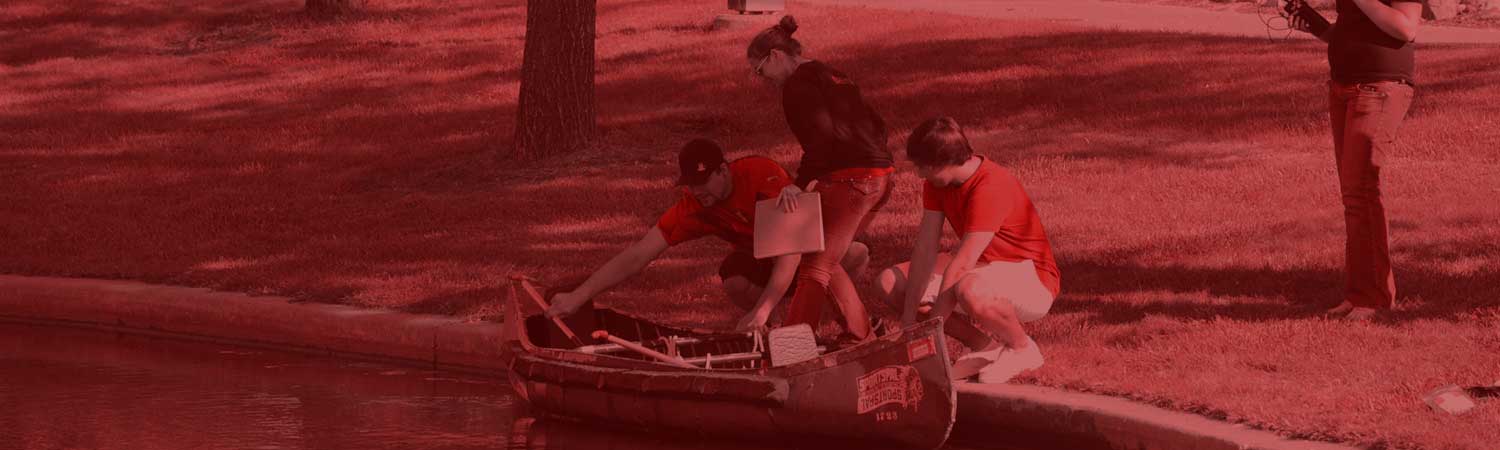 group of students taking samples from river