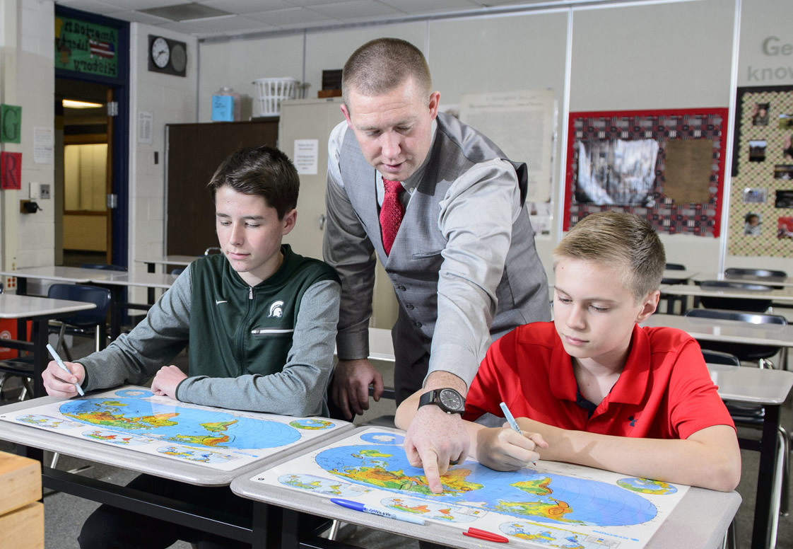 Teacher with two students