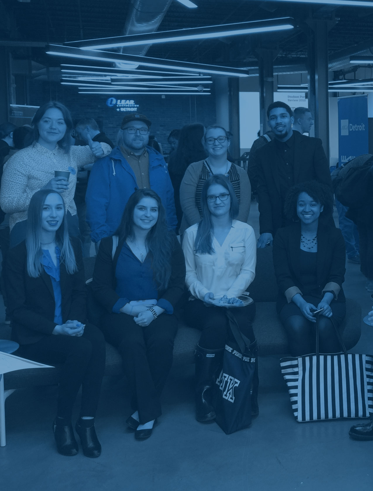 Six students standing in a group