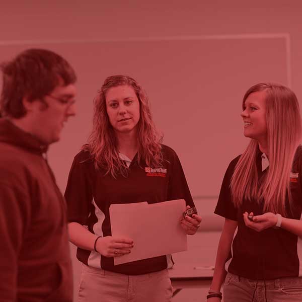 Students conducting health assessments