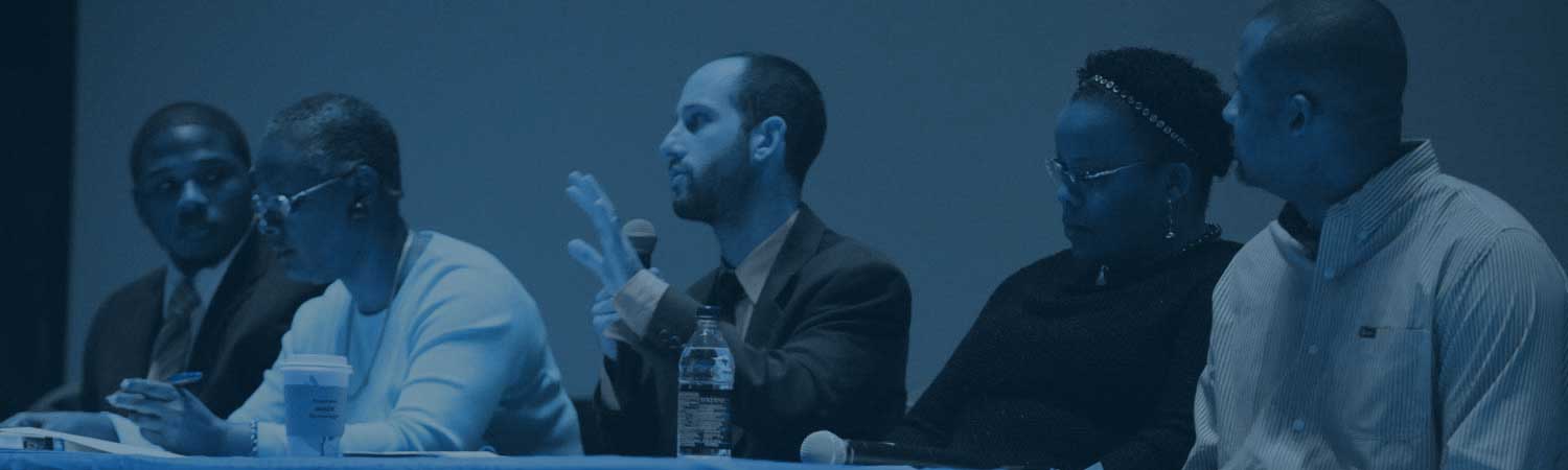 Man speaking to group of people