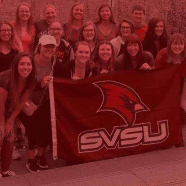 History group with svsu cardinal flag