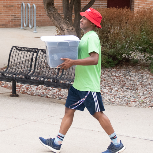 Student moving into on-campus housing
