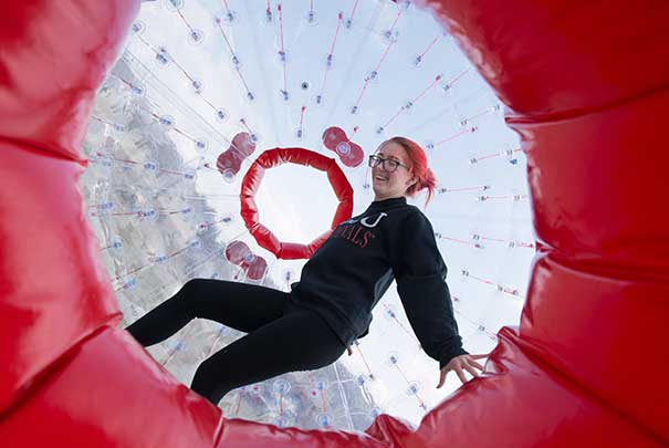students inside block up balls running around the UVs