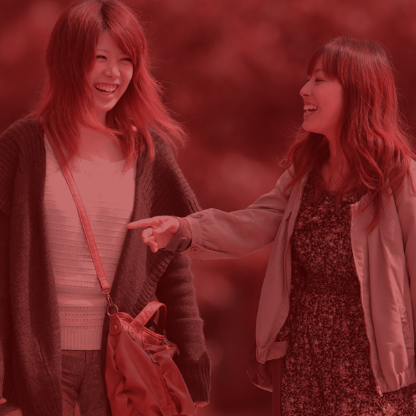 two friends walking on campus