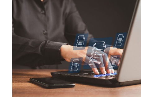 Stock photo of student, at laptop, viewing files.