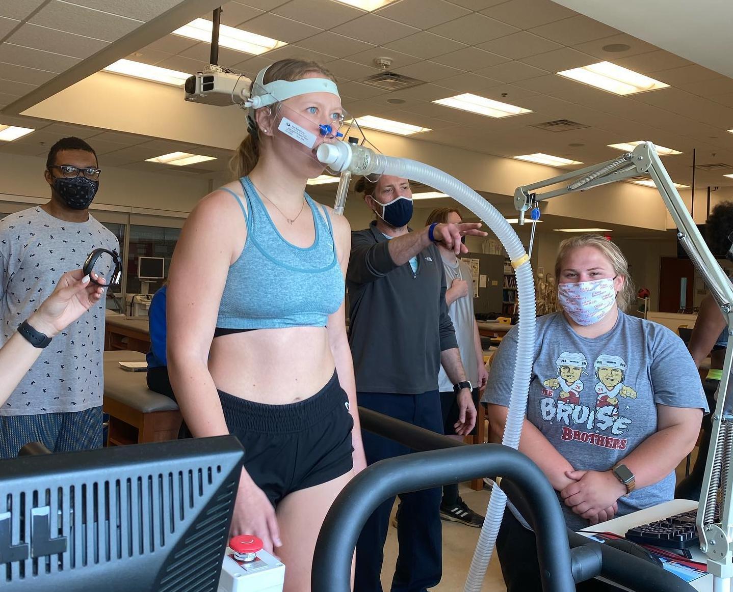 Students and classmates check body vitals