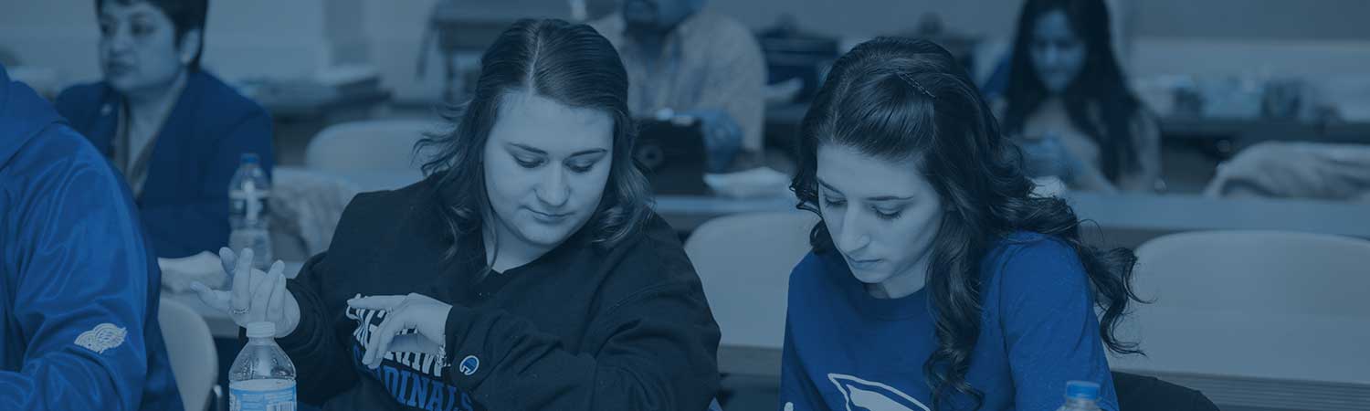 Marketing students work together in class